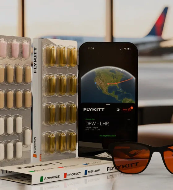 FlyKitt jet lag supplements, sunglasses, and mobile app displayed at an airport lounge.